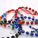 Pulsera Hilo Ojitos con Dije San Benito y Bolitas 2 de Plata .925